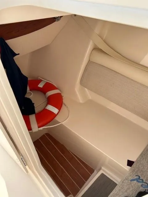 Slide: The Image of 2020 Grady-White Freedom 325 interior with life preserver and seating. - 27