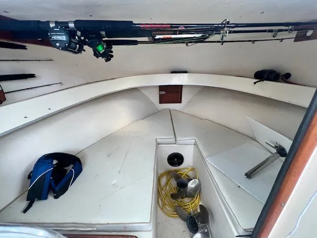 Slide: The Image of 1989 Parker 2520 Modified Vee Sport Cabin interior with fishing gear and equipment. - 6