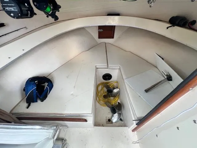 Slide: The Image of 1989 Parker 2520 Modified Vee Sport Cabin interior with storage and equipment. - 7