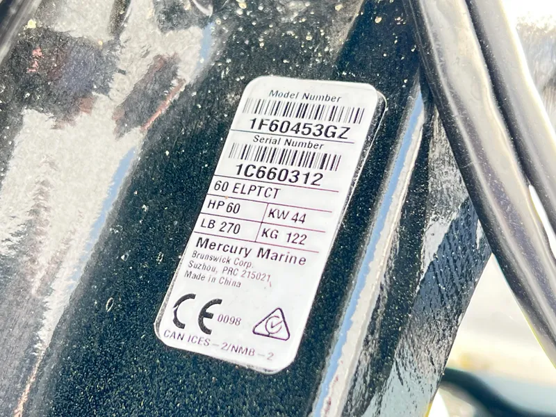 Slide: The Image of Sticker on a 2022 Boston Whaler 150 Montauk, displaying Mercury Marine engine specifications. - 9