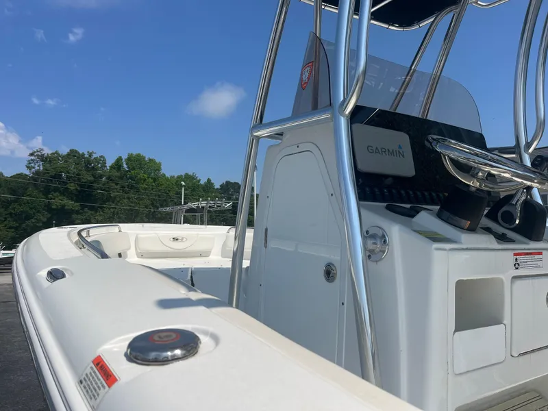Slide: The Image of 2018 Sea Hunt Triton 225 boat with Garmin equipment under clear blue sky. - 13