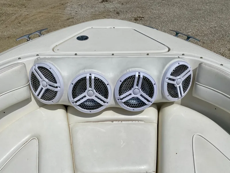 Slide: The Image of 2004 Sea Ray 290 SLX boat speakers on white seating area. - 17