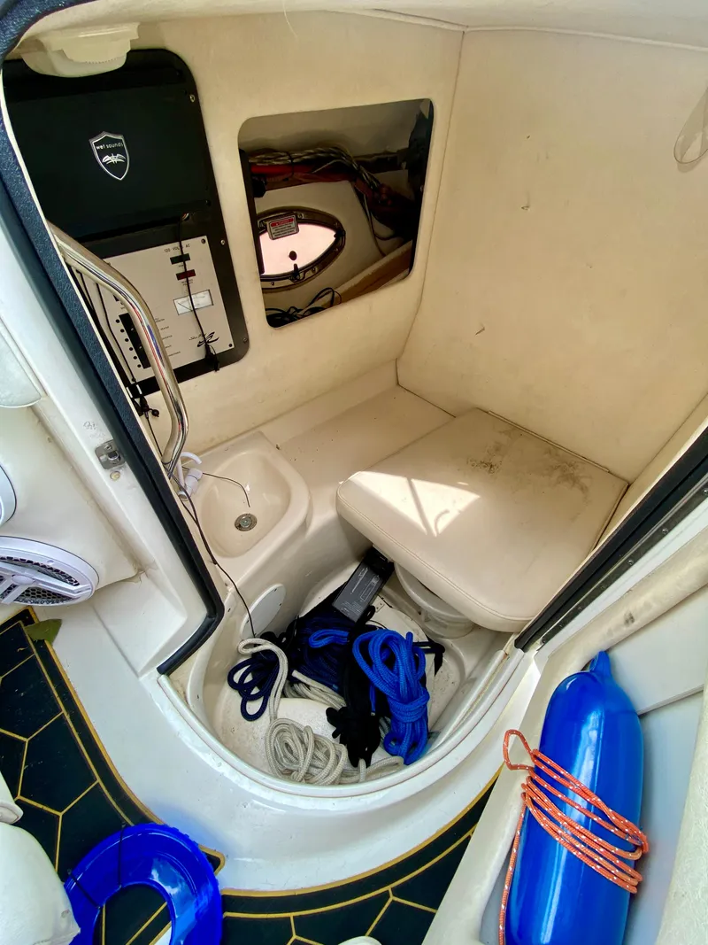 Slide: The Image of 2004 Sea Ray 290 SLX cabin interior with ropes and equipment. - 20