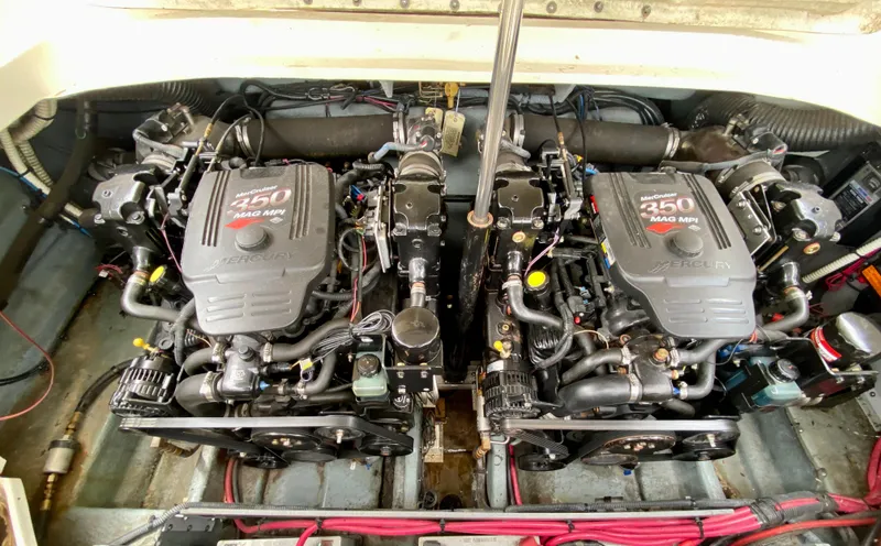 Slide: The Image of Twin engines of a 2004 Sea Ray 290 SLX boat, showcasing powerful 350 MAG MPI motors. - 21
