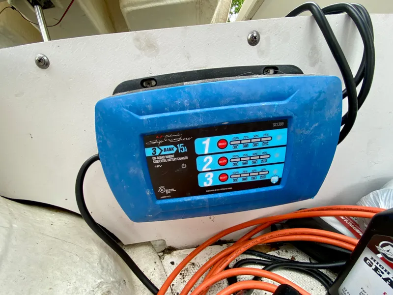 Slide: The Image of Blue marine battery charger on a 2004 Sea Ray 290 SLX boat. - 23