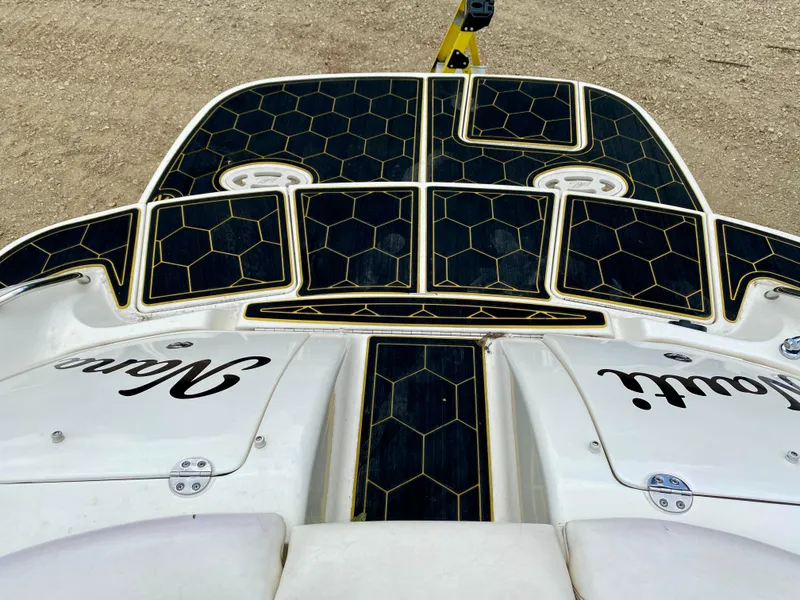 Slide: The Image of 2004 Sea Ray 290 SLX boat with custom deck design and name decals. - 4