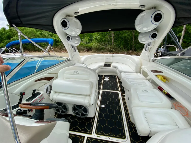 Slide: The Image of Luxurious 2004 Sea Ray 290 SLX boat interior with white seating and modern audio system. - 6