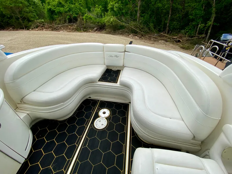 Slide: The Image of Luxurious 2004 Sea Ray 290 SLX boat interior with white leather seating and stylish flooring. - 7