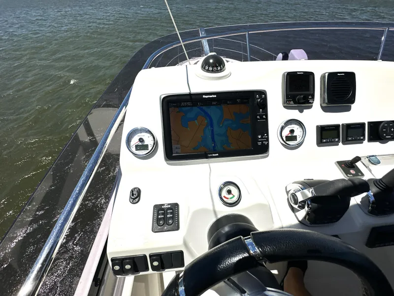 Slide: The Image of Helm of 2017 Prestige 500 yacht with navigation system and controls. - 16