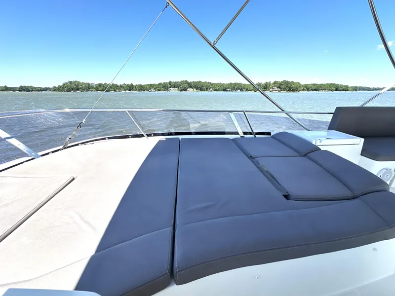 Slide: The Image of Luxurious 2017 Prestige 500 yacht with spacious sunbathing deck on serene waters. - 20