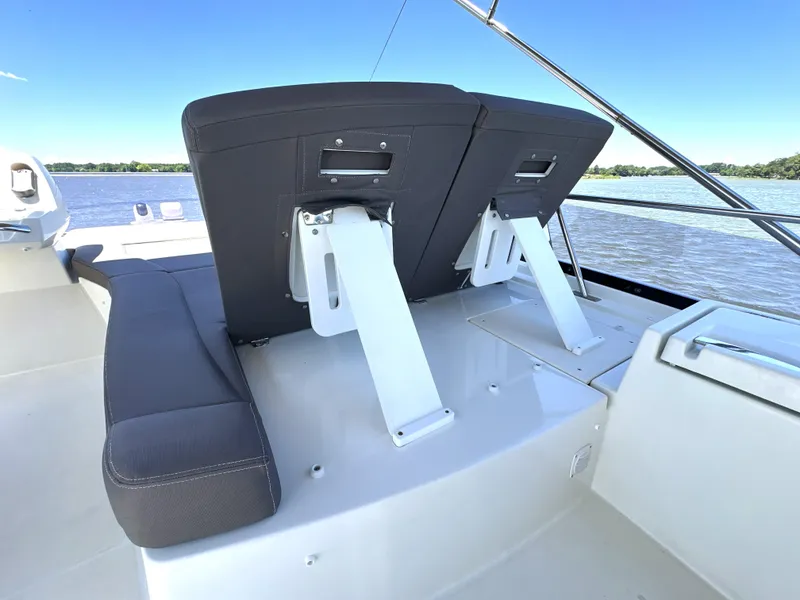 Slide: The Image of Luxury seating on 2017 Prestige 500 yacht, overlooking serene water. - 23