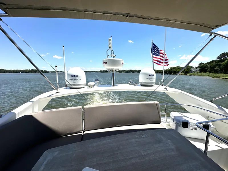Slide: The Image of Luxurious 2017 Prestige 500 yacht cruising on a serene lake under a clear blue sky. - 28