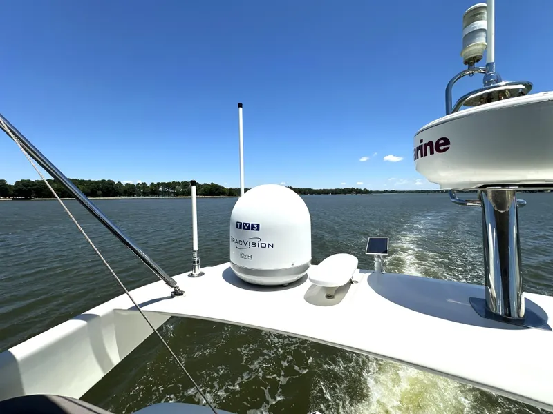 Slide: The Image of Prestige 500 yacht cruising on a sunny day, showcasing advanced navigation equipment, 2017 model. - 30