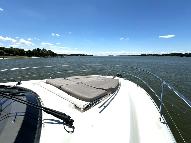 Slide: The Image of 2017 Prestige 500 yacht on calm waters under a clear blue sky. - 31