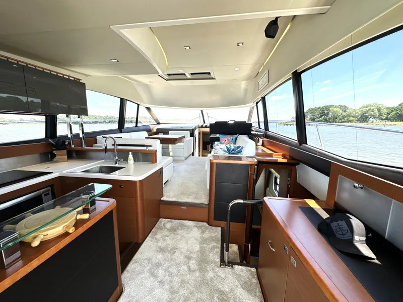 Slide: The Image of Luxurious interior of a 2017 Prestige 500 yacht with modern kitchen and scenic views. - 39