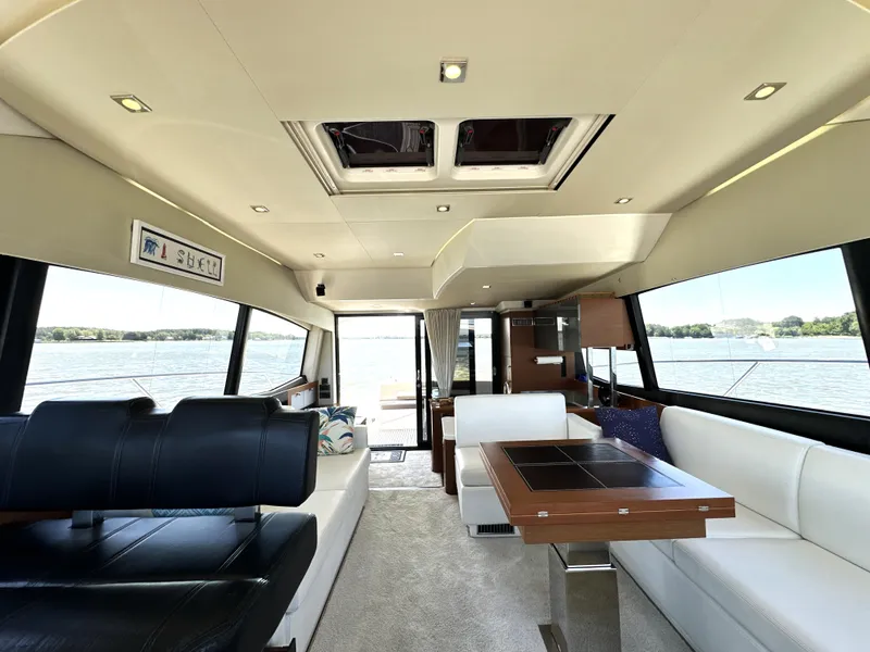 Slide: The Image of Luxurious interior of a 2017 Prestige 500 yacht with elegant seating and panoramic windows. - 40