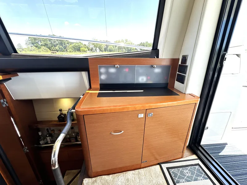 Slide: The Image of Luxurious interior of a 2017 Prestige 500 yacht with wooden cabinetry and modern design. - 42