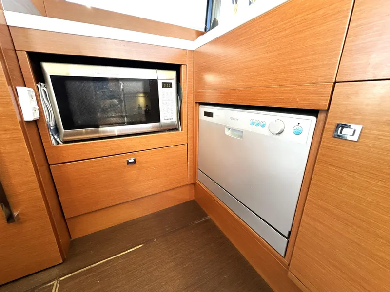 Slide: The Image of Modern kitchen area in a 2017 Prestige 500 yacht with microwave and dishwasher. - 46