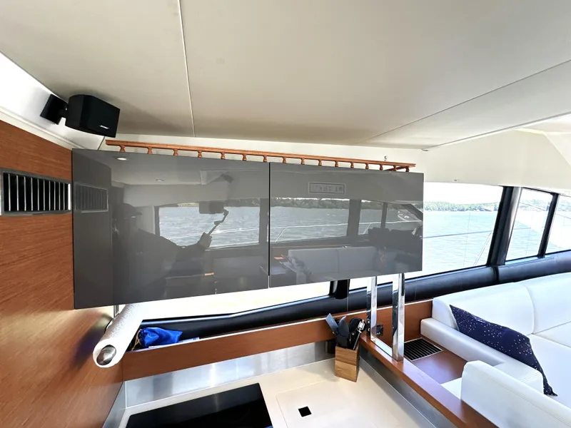 Slide: The Image of Interior of 2017 Prestige 500 yacht with modern cabinetry and scenic window view. - 49