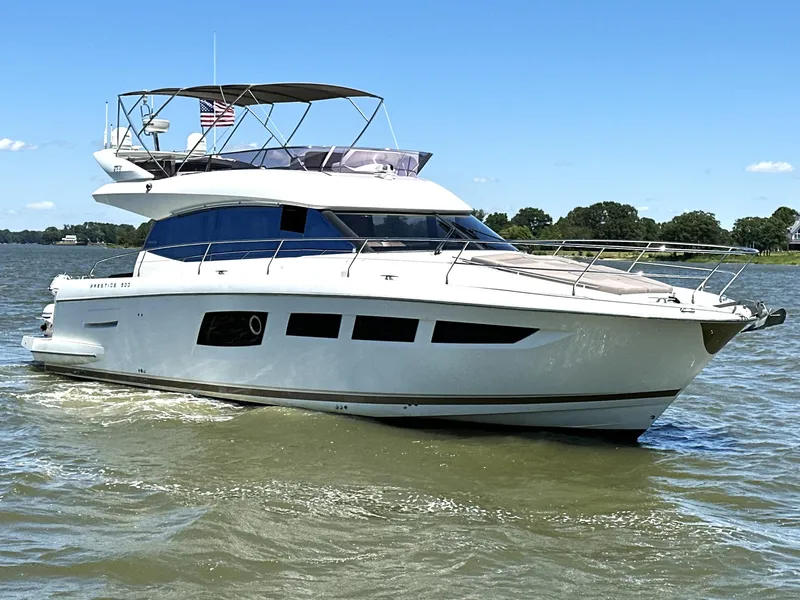 Slide: The Image of 2017 Prestige 500 yacht cruising on a sunny day with clear skies. - 5