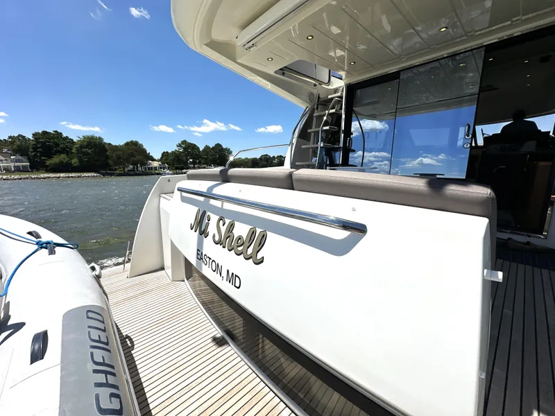 Slide: The Image of Luxury 2017 Prestige 500 yacht docked, featuring sleek design and spacious deck. - 8