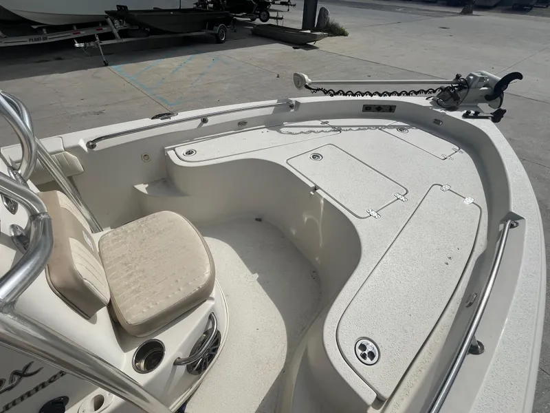 Slide: The Image of 2015 Sea Chaser 210 LX Bay Runner boat interior with seating and storage compartments. - 11