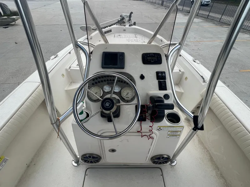 Slide: The Image of 2015 Sea Chaser 210 LX Bay Runner boat console with steering wheel and controls. - 13