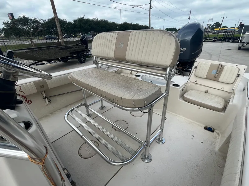 Slide: The Image of 2015 Sea Chaser 210 LX Bay Runner boat interior with seating and console. - 14