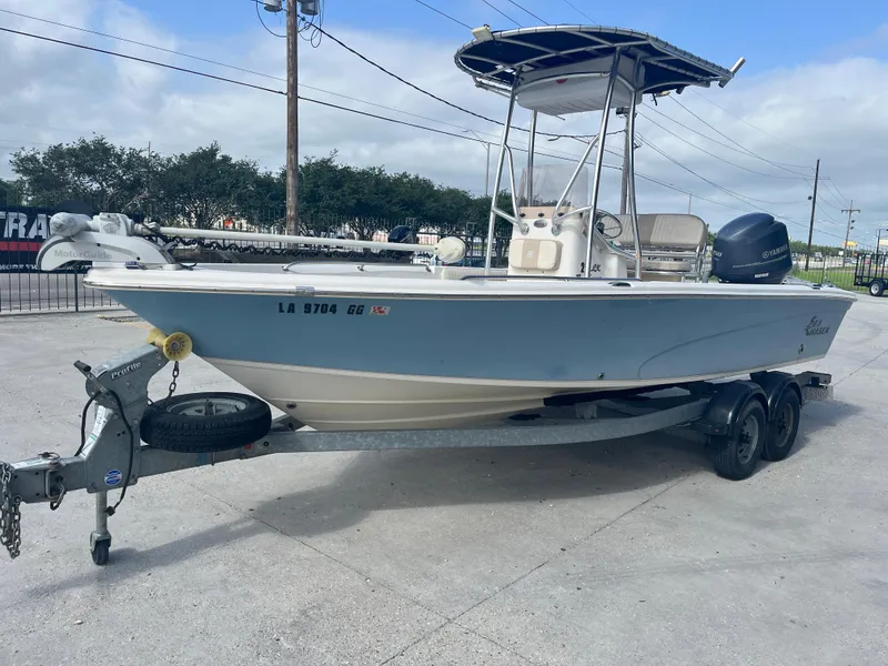 Slide: The Image of 2015 Sea Chaser 210 LX Bay Runner boat on trailer, parked outdoors. - 5