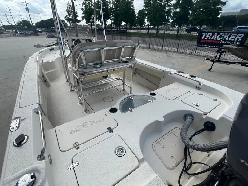 Slide: The Image of 2015 Sea Chaser 210 LX Bay Runner boat interior with seating and storage compartments. - 9