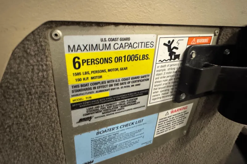 Slide: The Image of 2004 Alumacraft Trophy 175 capacity label, 6 persons or 1005 lbs, safety warnings visible. - 14