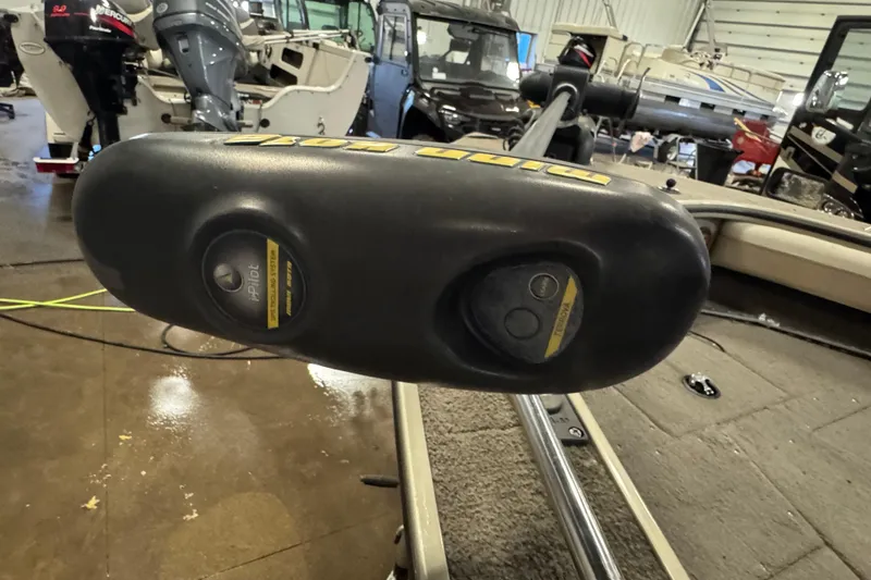 Slide: The Image of 2004 Alumacraft Trophy 175 boat with i-Pilot trolling motor in a showroom. - 19