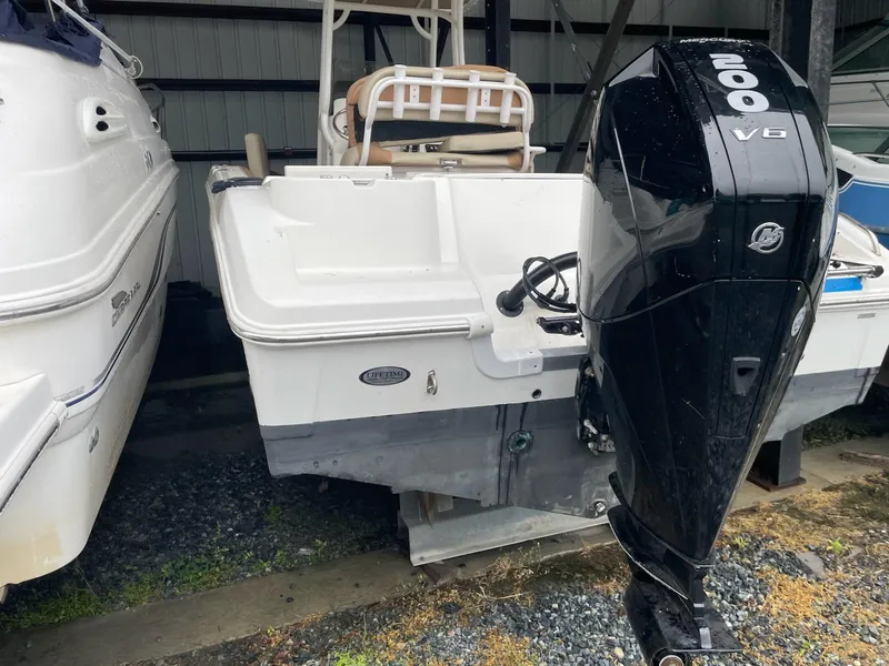 Slide: The Image of 2005 Cobalt 246 boat with a 200 HP Mercury V6 outboard motor. - 17