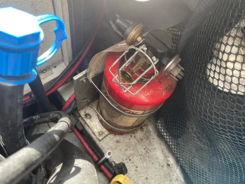 Slide: The Image of Engine compartment of a 2005 Cobalt 246 with a mounted fire extinguisher. - 9