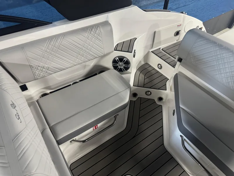 Slide: The Image of 2025 Sea Ray SDX 250 boat interior with white seating and modern design. - 10