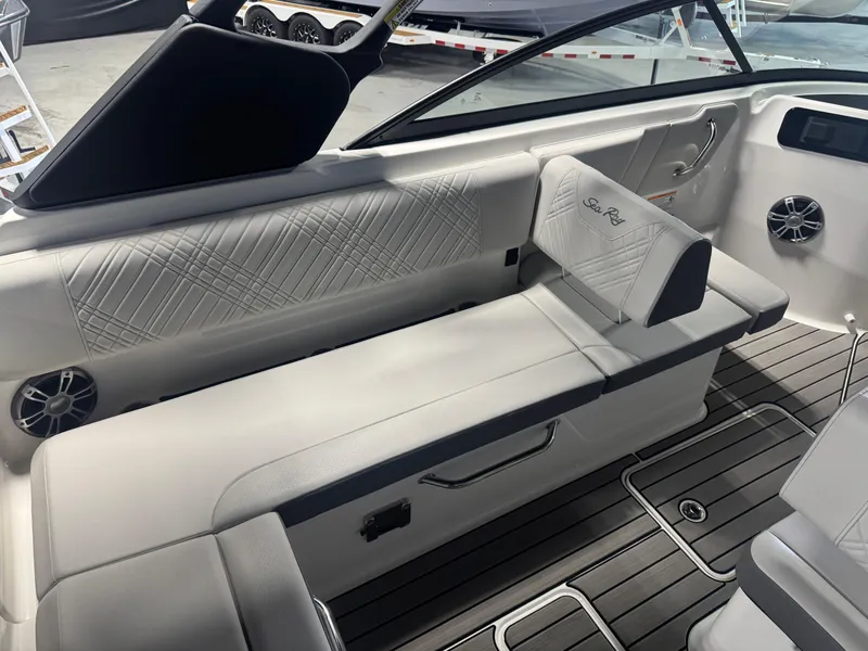 Slide: The Image of 2025 Sea Ray SDX 250 boat interior with white seating and modern design. - 12