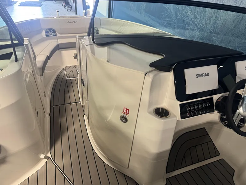 Slide: The Image of 2025 Sea Ray SDX 250 boat with spacious seating and sleek design. - 5