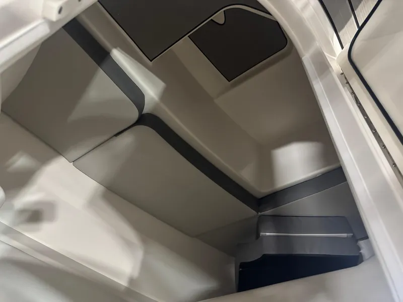 Slide: The Image of 2025 Sea Ray SDX 250 boat interior with luxurious seating and modern dashboard. - 6