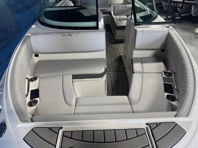 Slide: The Image of 2025 Sea Ray SDX 250 boat interior with white seating and sleek design. - 8