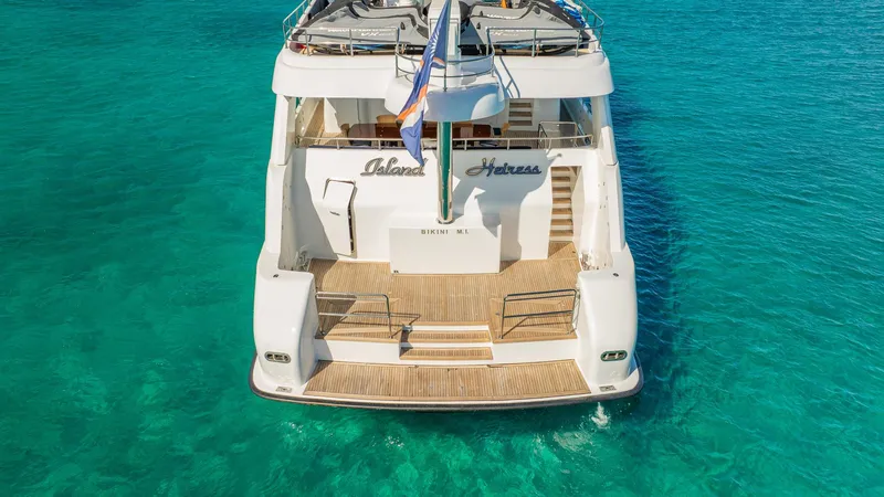 Slide: The Image of Luxury yacht Cheoy Lee 145 Global Series, 1996, on clear turquoise water. - 10