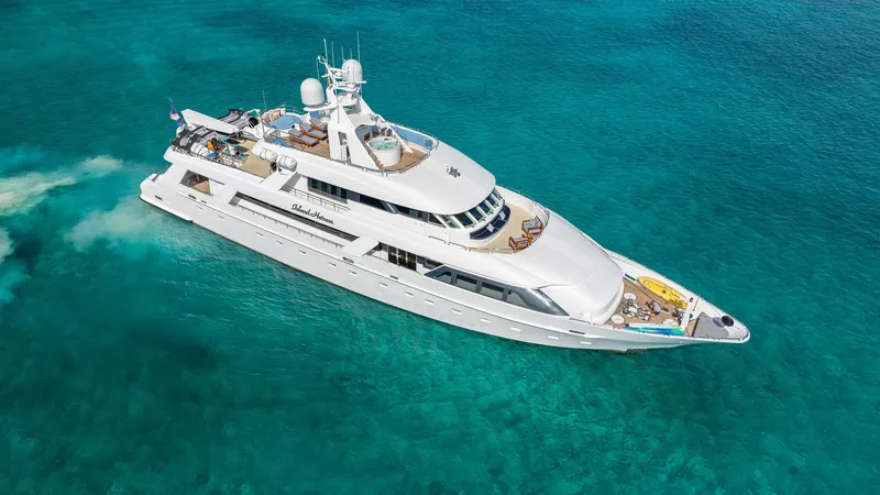 Slide: The Image of Luxurious 1996 Cheoy Lee 145 Global Series yacht cruising in clear turquoise waters. - 2