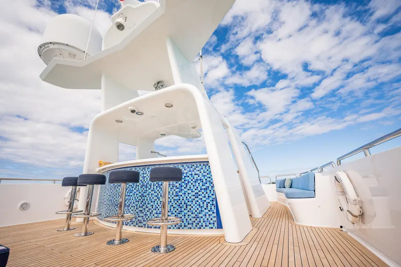 Slide: The Image of Luxurious deck of 1996 Cheoy Lee 145 Global Series yacht with bar and seating. - 22