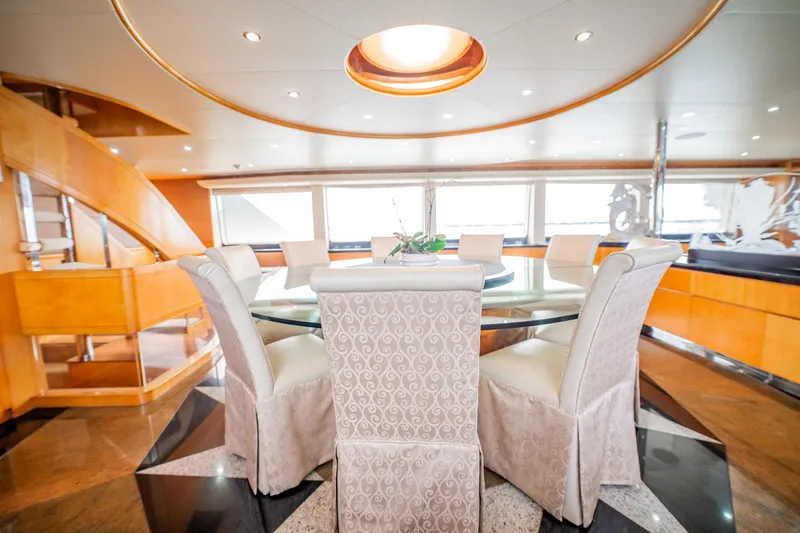 Slide: The Image of Luxurious dining area on 1996 Cheoy Lee 145 Global Series yacht, featuring elegant decor and panoramic windows. - 29