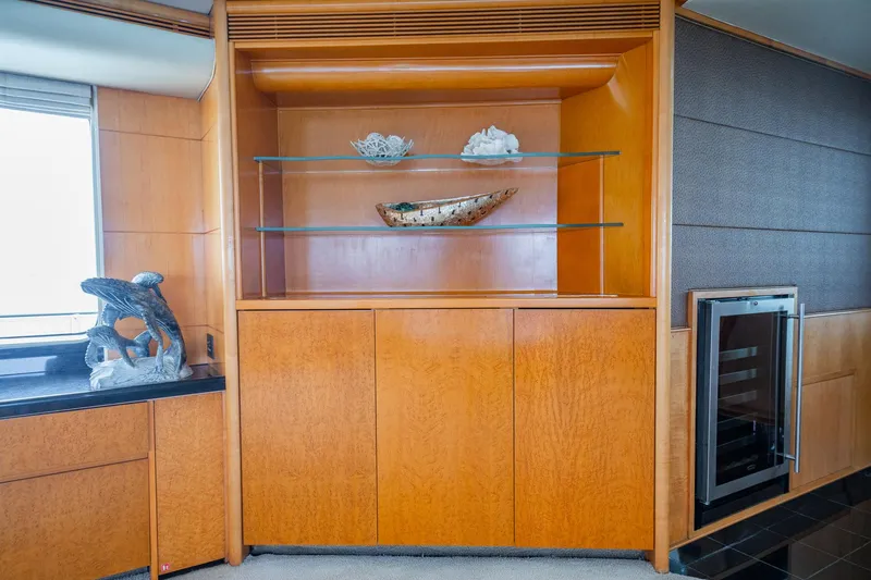 Slide: The Image of Luxurious wooden interior of 1996 Cheoy Lee 145 Global Series yacht with decorative shelves. - 39