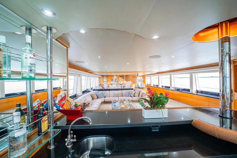 Slide: The Image of Luxurious interior of 1996 Cheoy Lee 145 Global Series yacht with modern bar and seating area. - 42