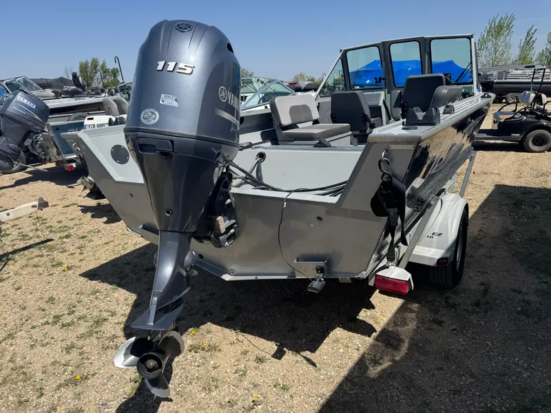 Slide: The Image of 2017 Smoker Craft 202 Phantom boat with Yamaha 115 outboard motor, parked on a trailer. - 3