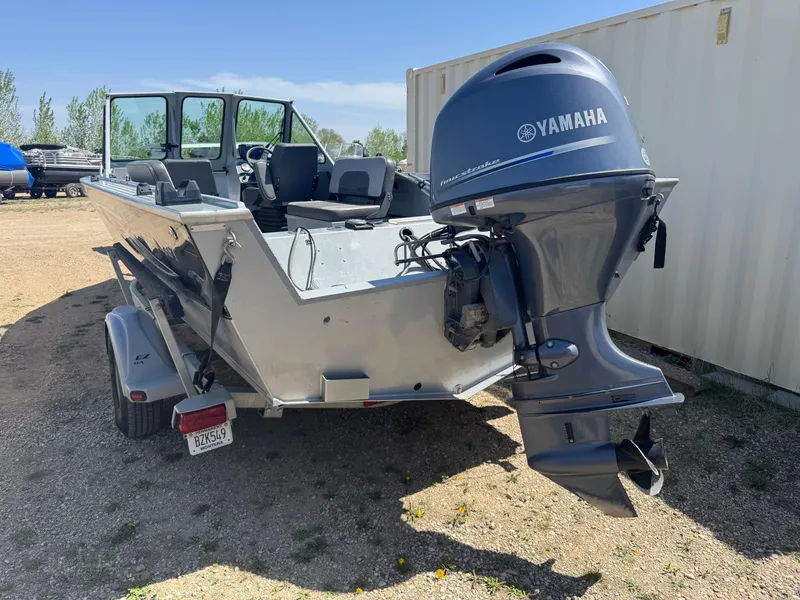Slide: The Image of 2017 Smoker Craft 202 Phantom boat with Yamaha outboard motor, parked on a trailer. - 4