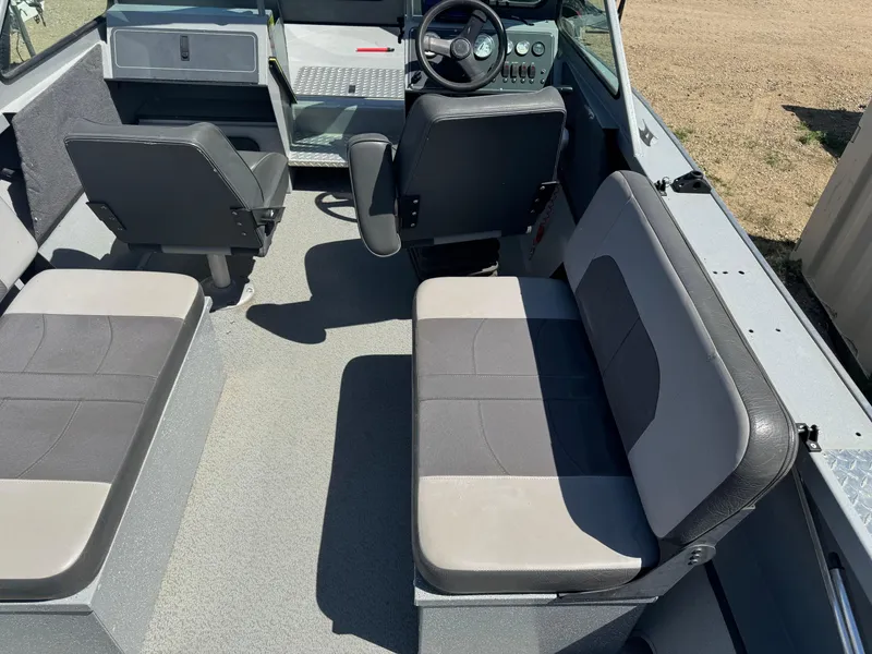 Slide: The Image of 2017 Smoker Craft 202 Phantom boat interior with seating and steering console. - 6