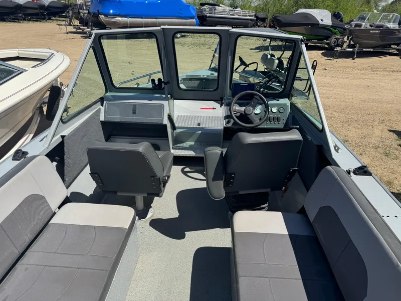 Slide: The Image of 2017 Smoker Craft 202 Phantom boat interior with seating and steering wheel. - 8