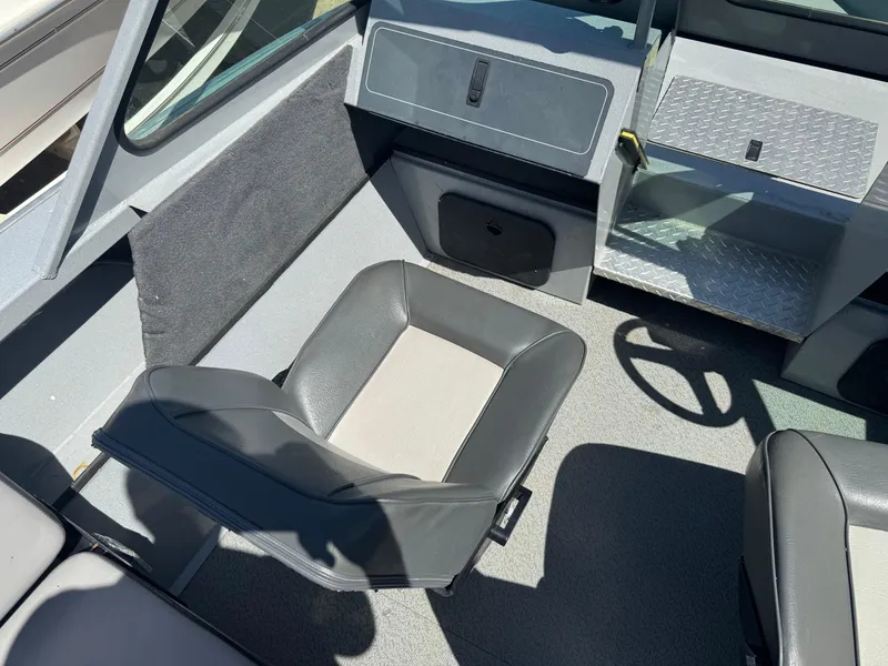 Slide: The Image of 2017 Smoker Craft 202 Phantom boat interior with seating and steering wheel. - 9